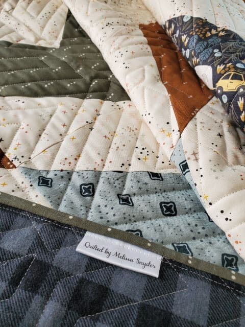 Folded quilt with personalize label