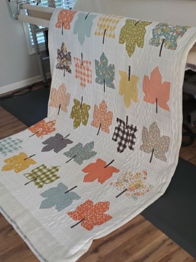 Fall Leaves Quilt in Cozy Up Fabrics on a longarm